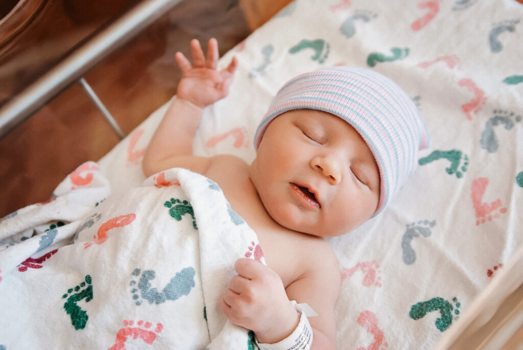 newborn baby girl in the hospital after being delivered by the help of a doula in dallas texas