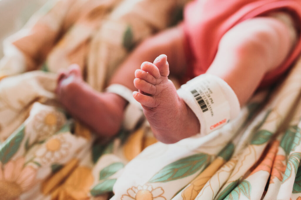 a newborns foot with a hospital band in a dallas hospital