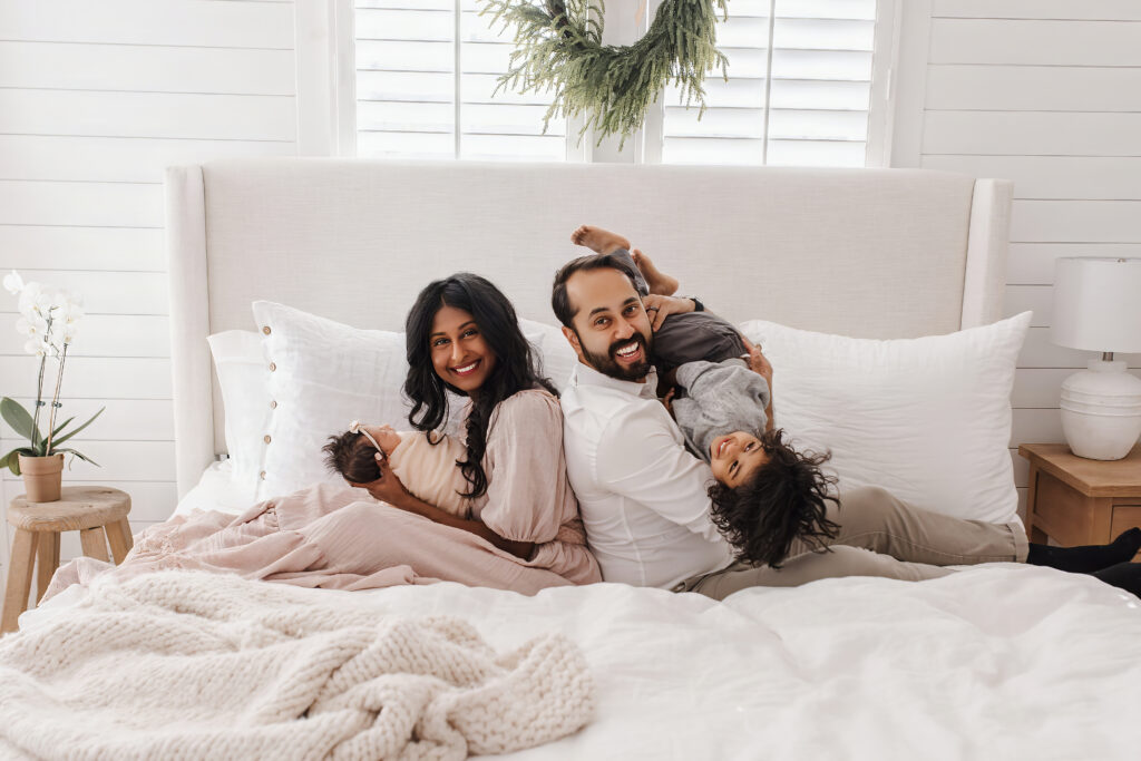 Family with newborn in home lifestyle newborn photography McKinney TX