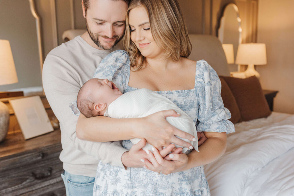 Lifestyle newborn studio session near Denton Texas with newborn baby resting peacefully in warm natural light